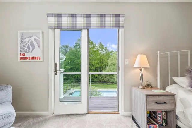 a view of hallway with furniture and a window