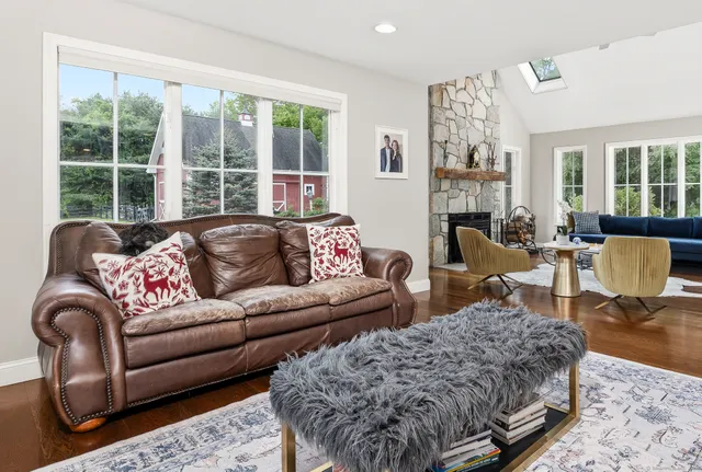 a living room with furniture or couch and a large window