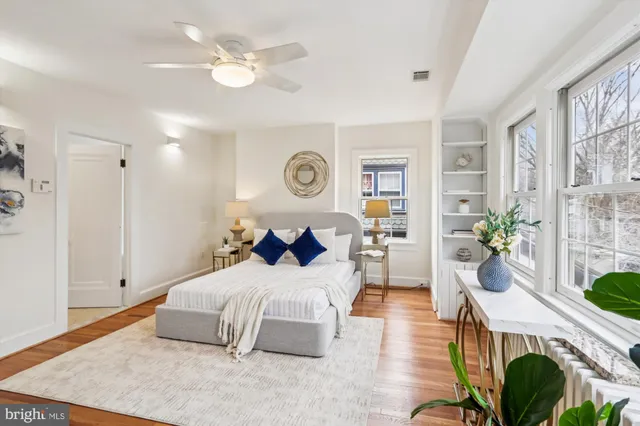 a bathroom with a sink mirror and shower