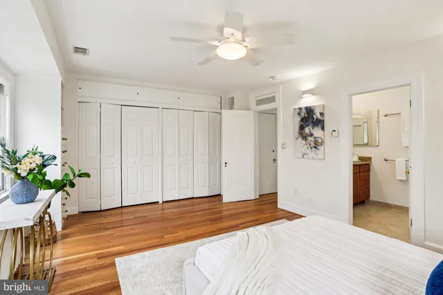 a living room with furniture and a book shelf