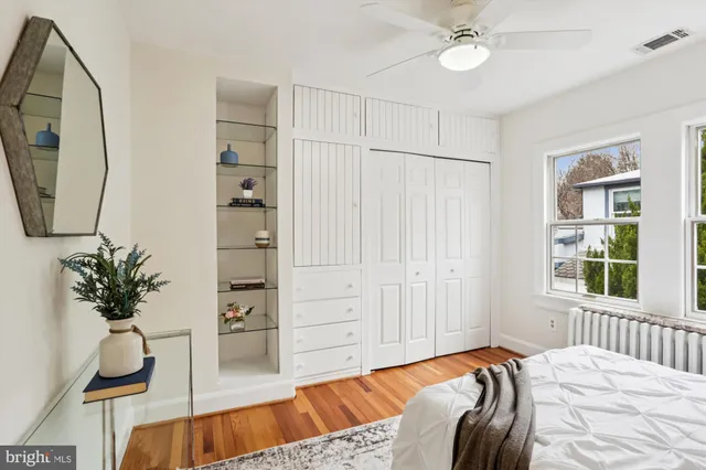 a kitchen with kitchen island granite countertop a sink and a wooden cabinets