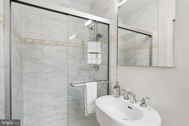 a kitchen with a refrigerator and a sink