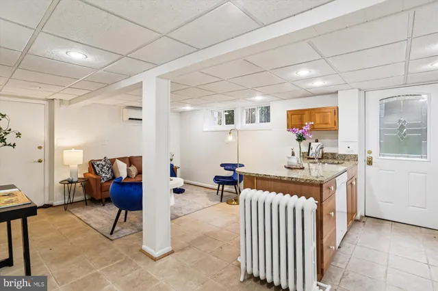 a front view of a house with a large window