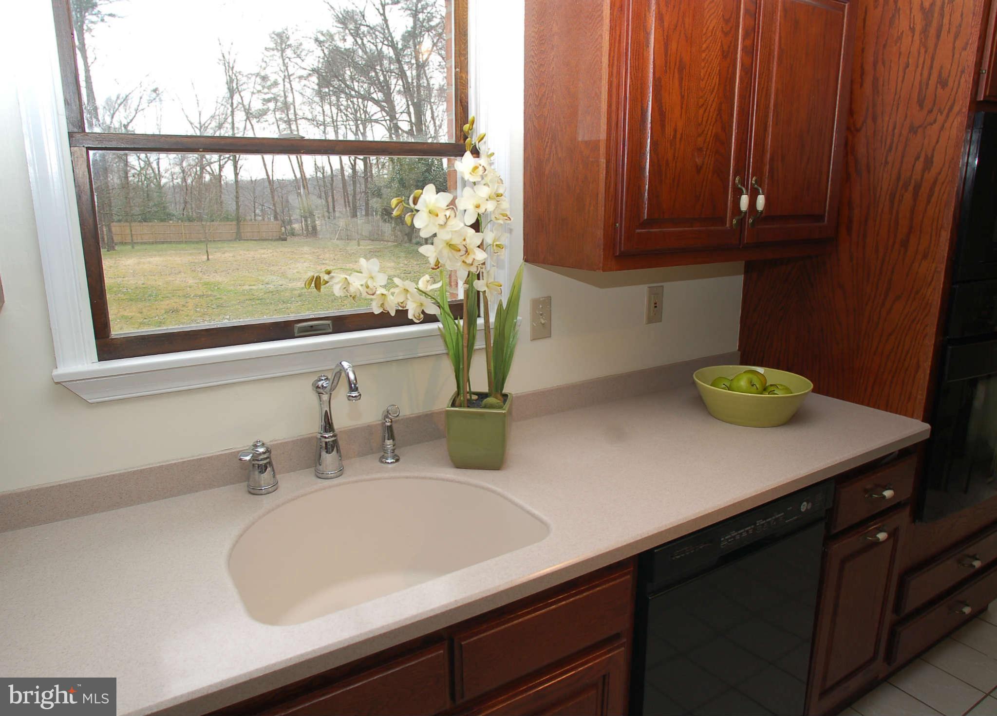 327 Magothy Bridge Road Pasadena, MD 21122 - Photo 3 of 30 a bathroom with a sink and a mirror