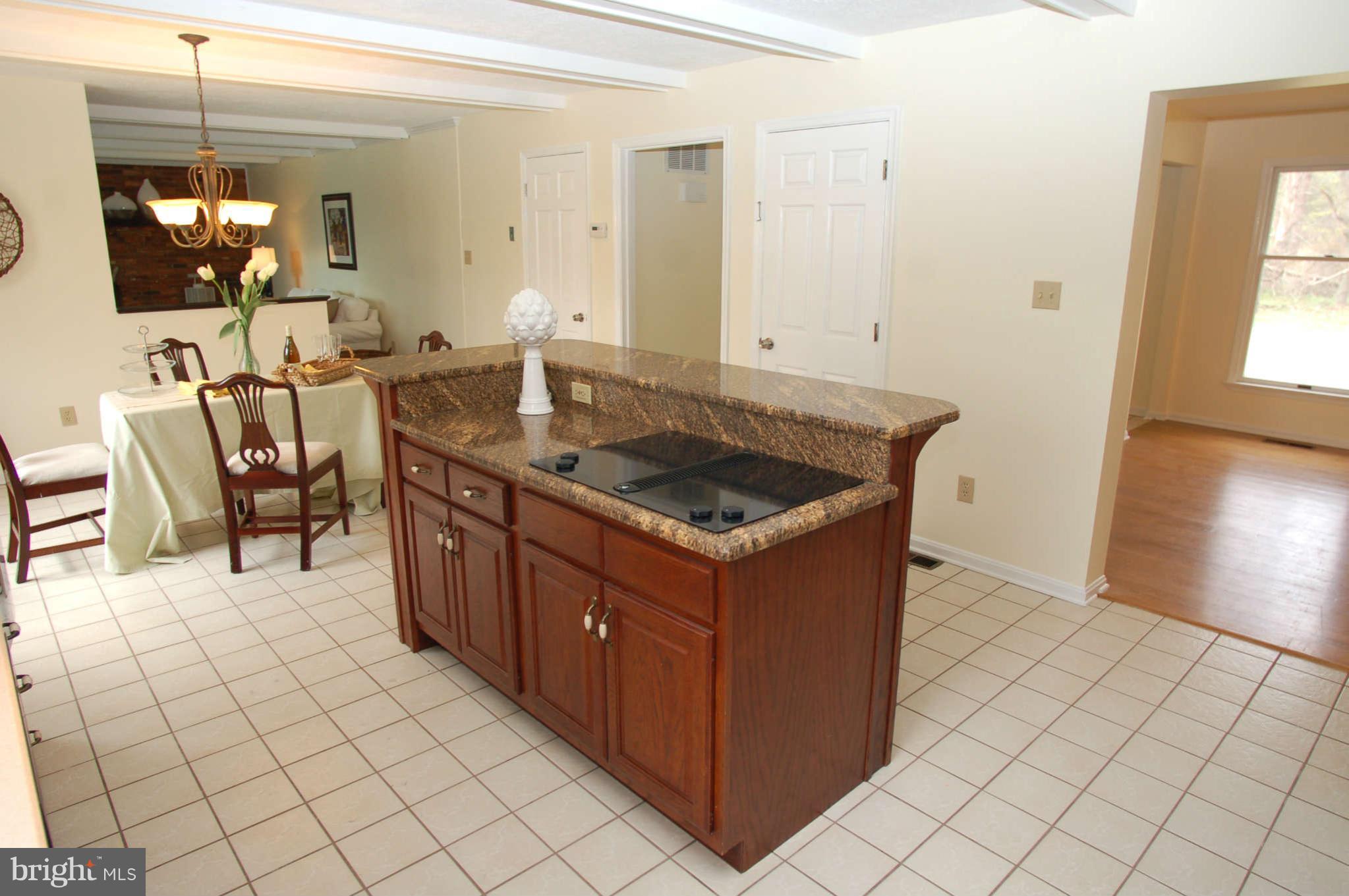 327 Magothy Bridge Road Pasadena, MD 21122 - Photo 5 of 30 a kitchen with stainless steel appliances granite countertop a sink and a stove