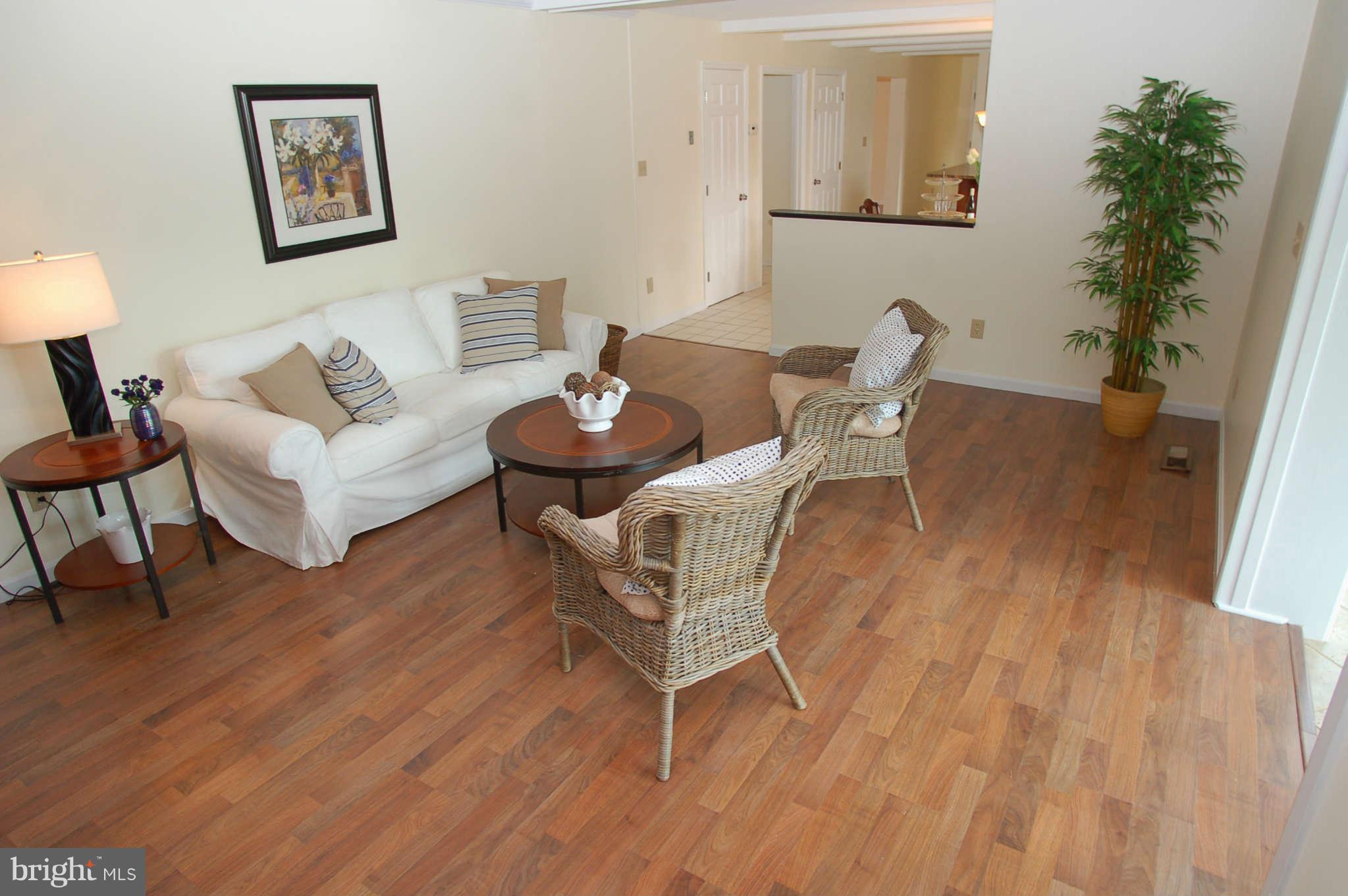 327 Magothy Bridge Road Pasadena, MD 21122 - Photo 8 of 30 a living room with furniture and a wooden floor