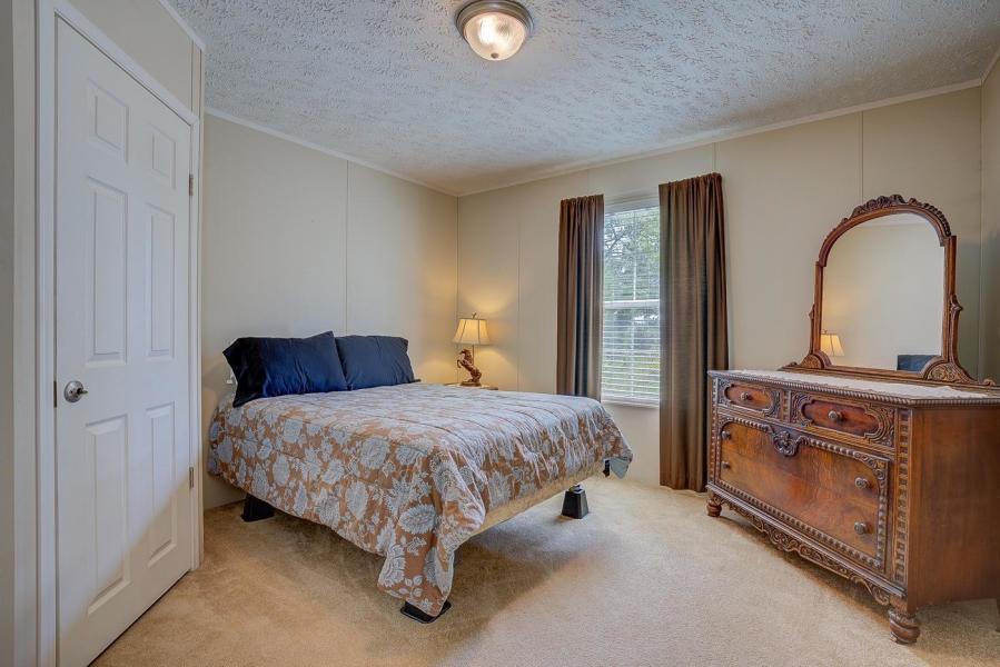 2112 Level Run Road Hurt, VA 24563 - Photo 50 of 56 a spacious bedroom with a bed and a dresser