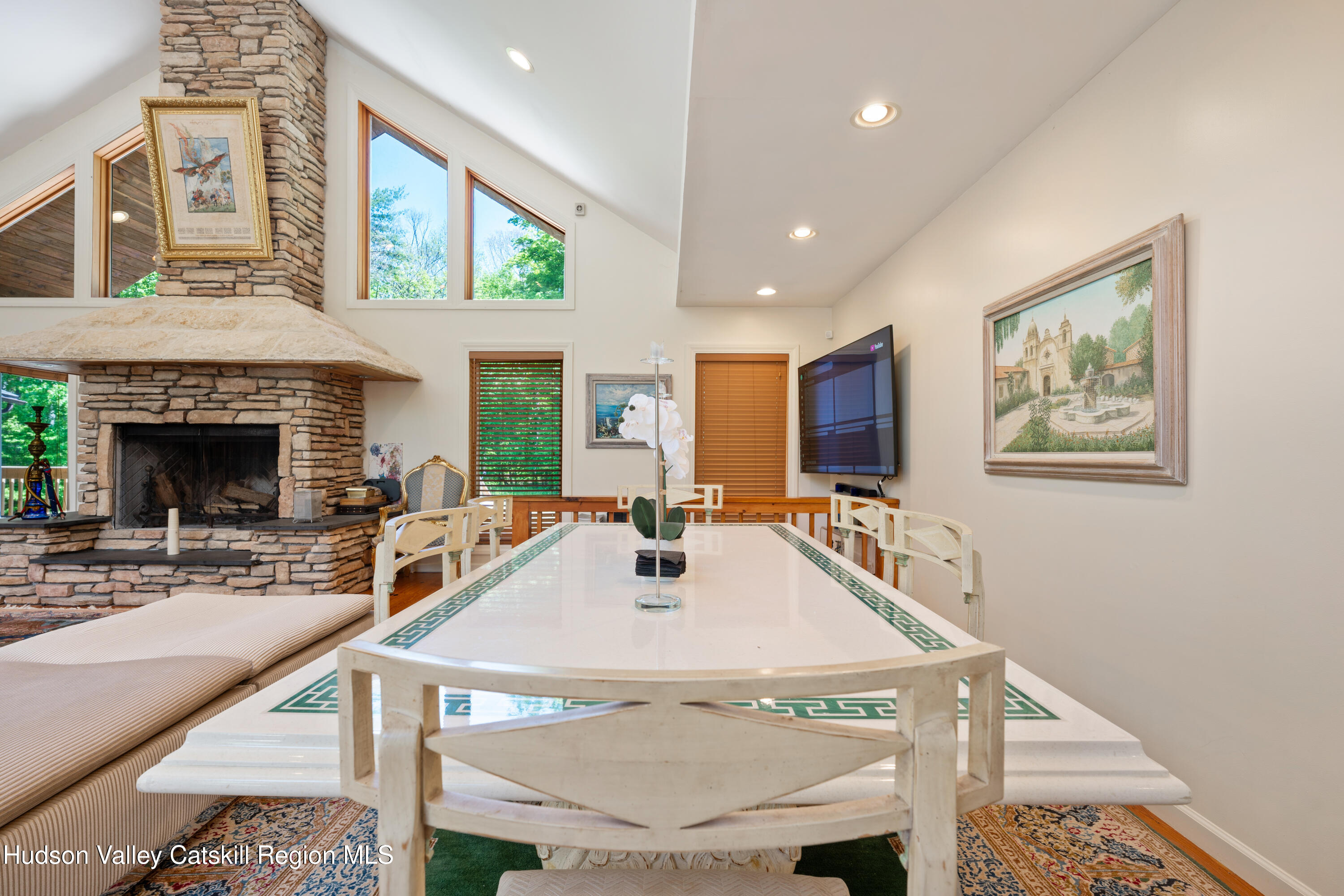 537 Mossy Hill Road Catskill, NY 12414 - Photo 76 of 105 a view of a dining room with furniture window and wooden floor