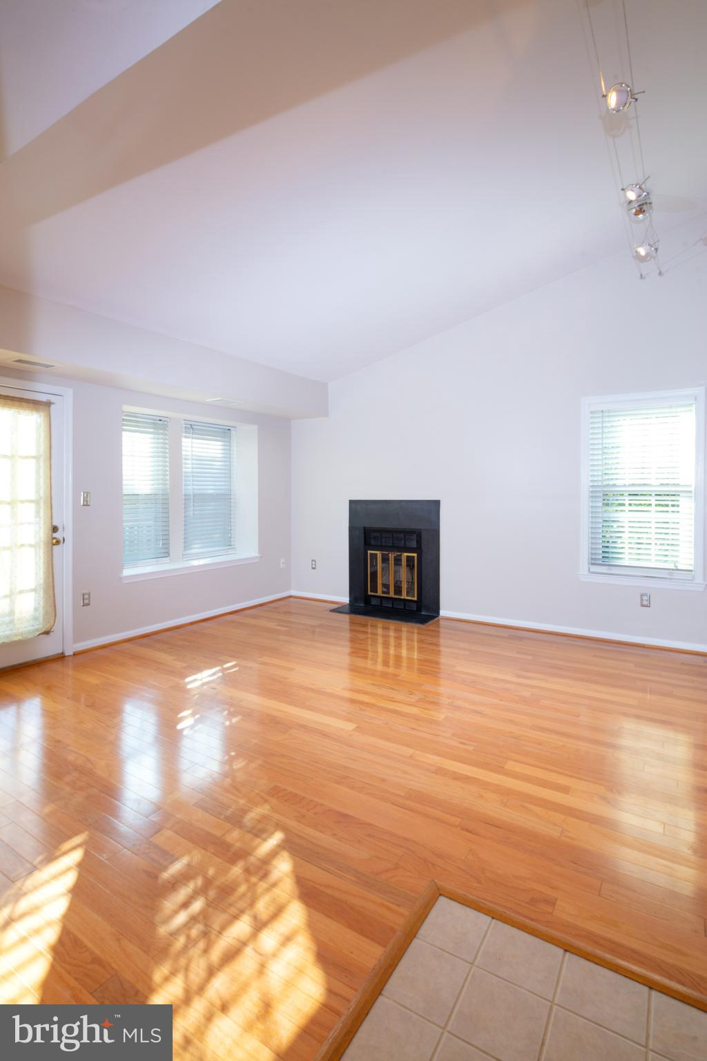 Living room w/ vaulted ceiling