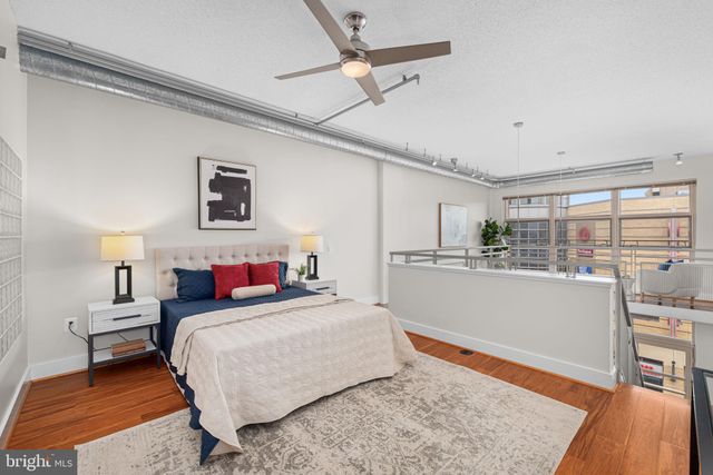 a view of living room with furniture and a rug