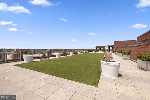 a view of a backyard with sitting area