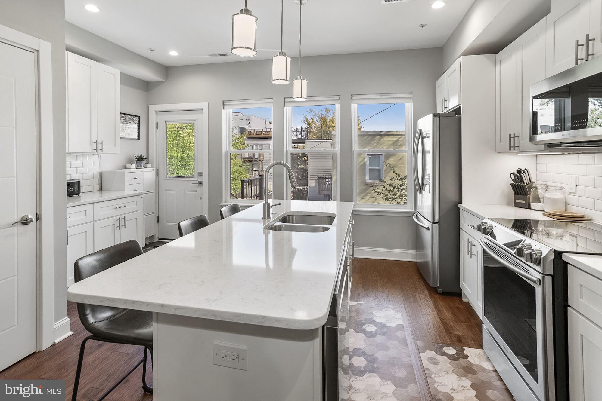 1105 7th Street Northeast, Unit 2 Washington, DC 20002 - Photo 4 of 33 Beautiful updated kitchen with bar seating