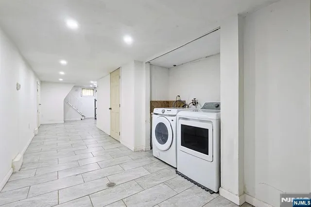 a view of a storage & utility room with washer and dryer
