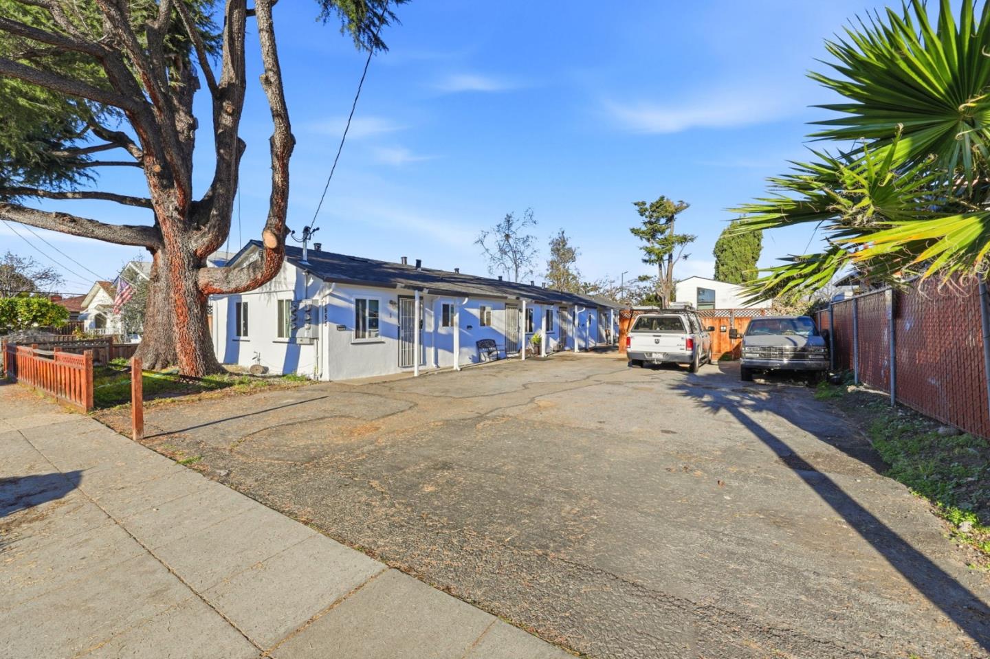 1555 Washington Street Santa Clara, CA 95050 - Photo 15 of 19 a yellow house with trees in front of it