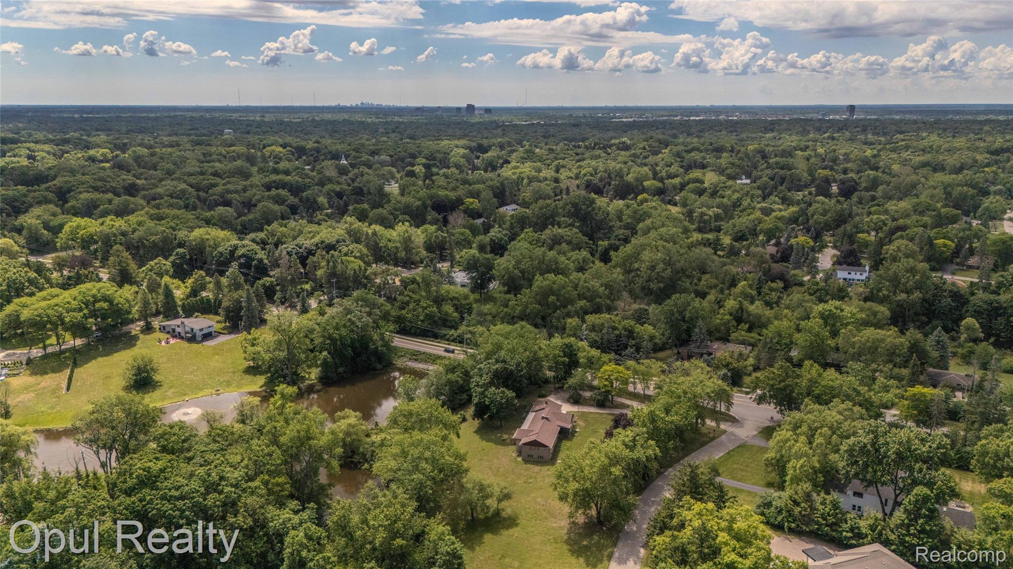 6455 Norham Road Bloomfield Hills, MI 48301 - Photo 71 of 93 Expansive aerial perspective showcasing a residential property surrounded by mature trees