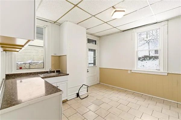 a kitchen with a stove a sink and a refrigerator