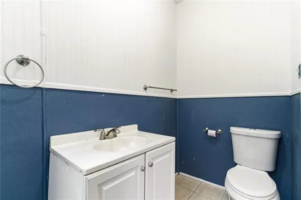 a view of empty room with wooden floor and fireplace