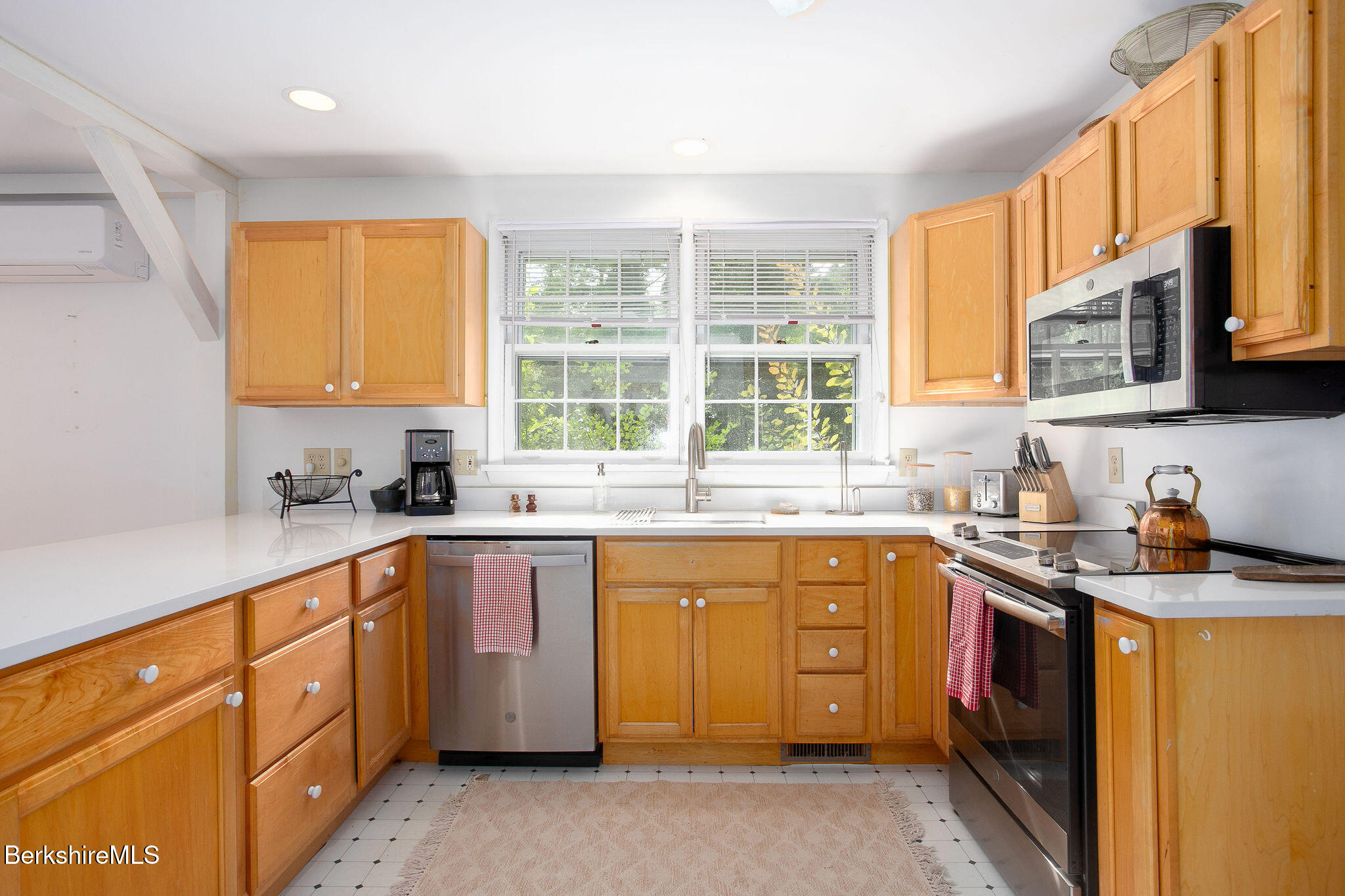 68 Creamery Road Egremont, MA 01230 - Photo 11 of 21 a kitchen with stainless steel appliances granite countertop wooden cabinets sink and window
