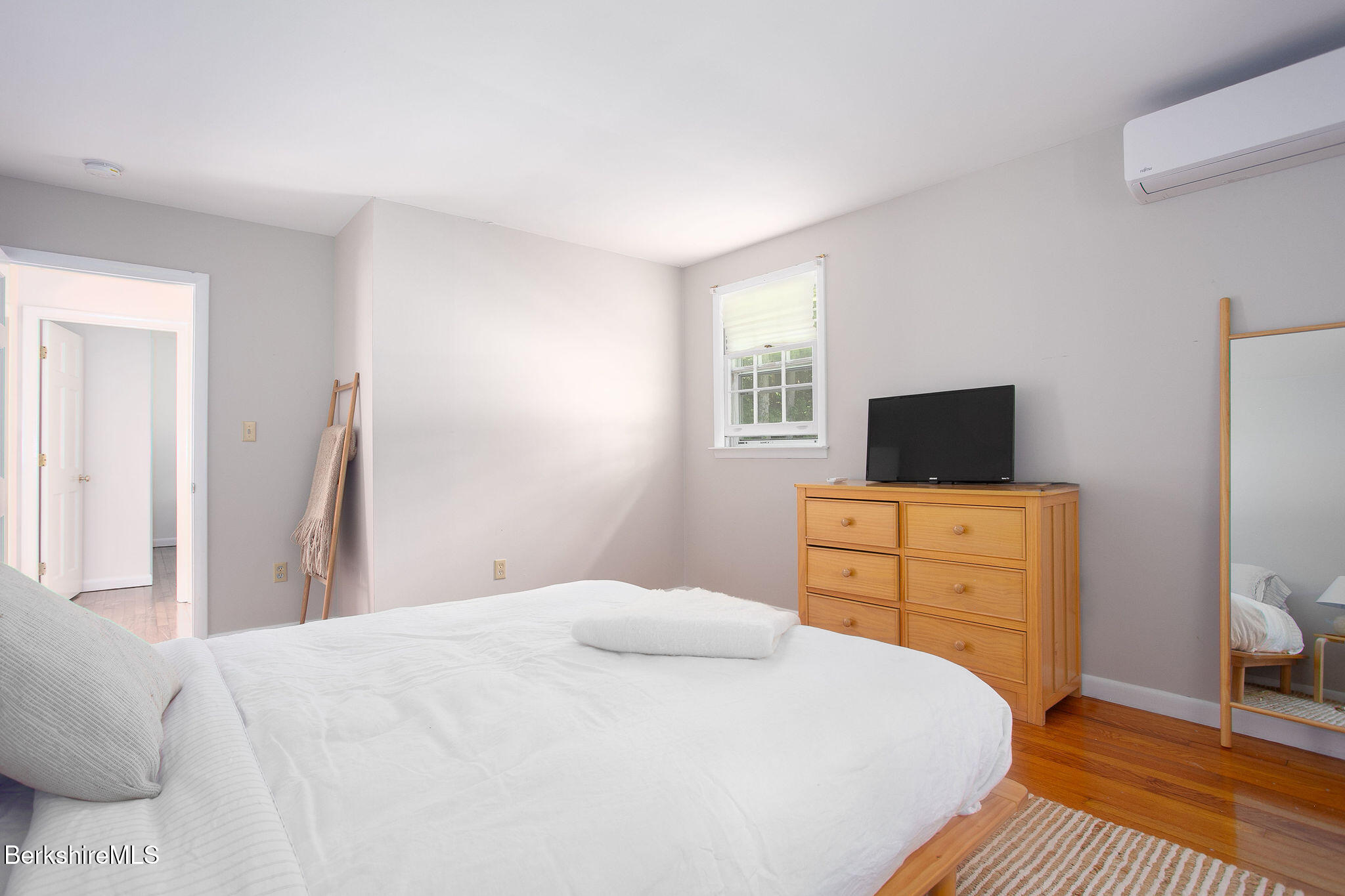 68 Creamery Road Egremont, MA 01230 - Photo 14 of 21 a bedroom with a bed and a flat screen tv