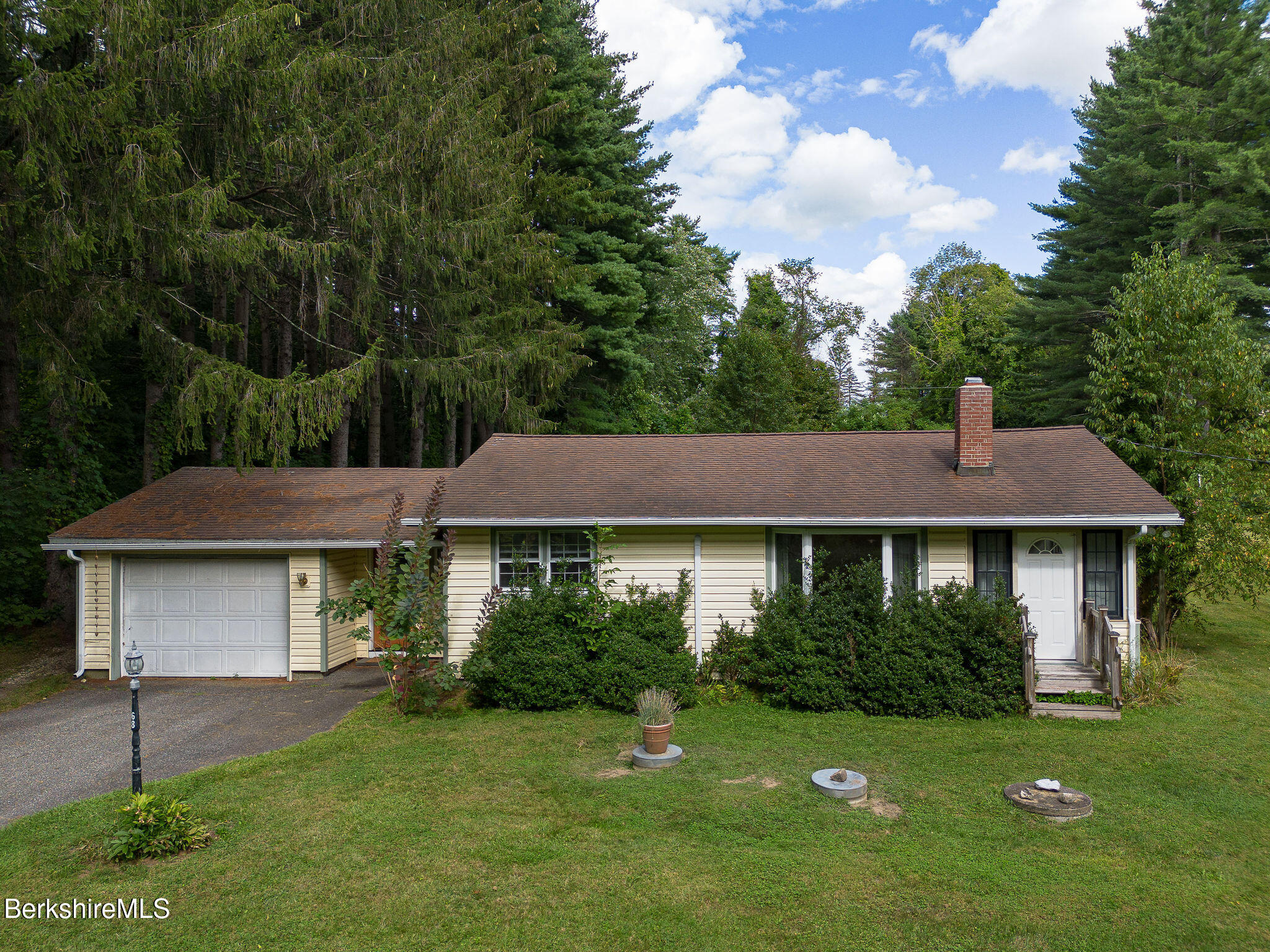 68 Creamery Road Egremont, MA 01230 - Photo 18 of 21 a front view of a house with a garden