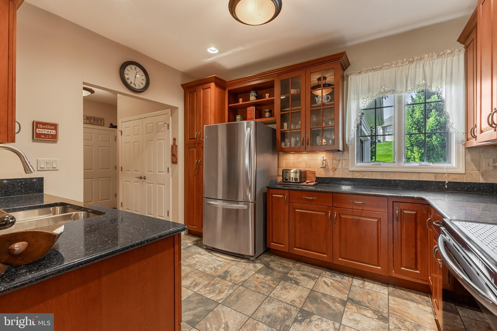 169 Quarry Street Bellefonte, PA 16823 - Photo 11 of 30 a kitchen with stainless steel appliances granite countertop a refrigerator a sink and a stove