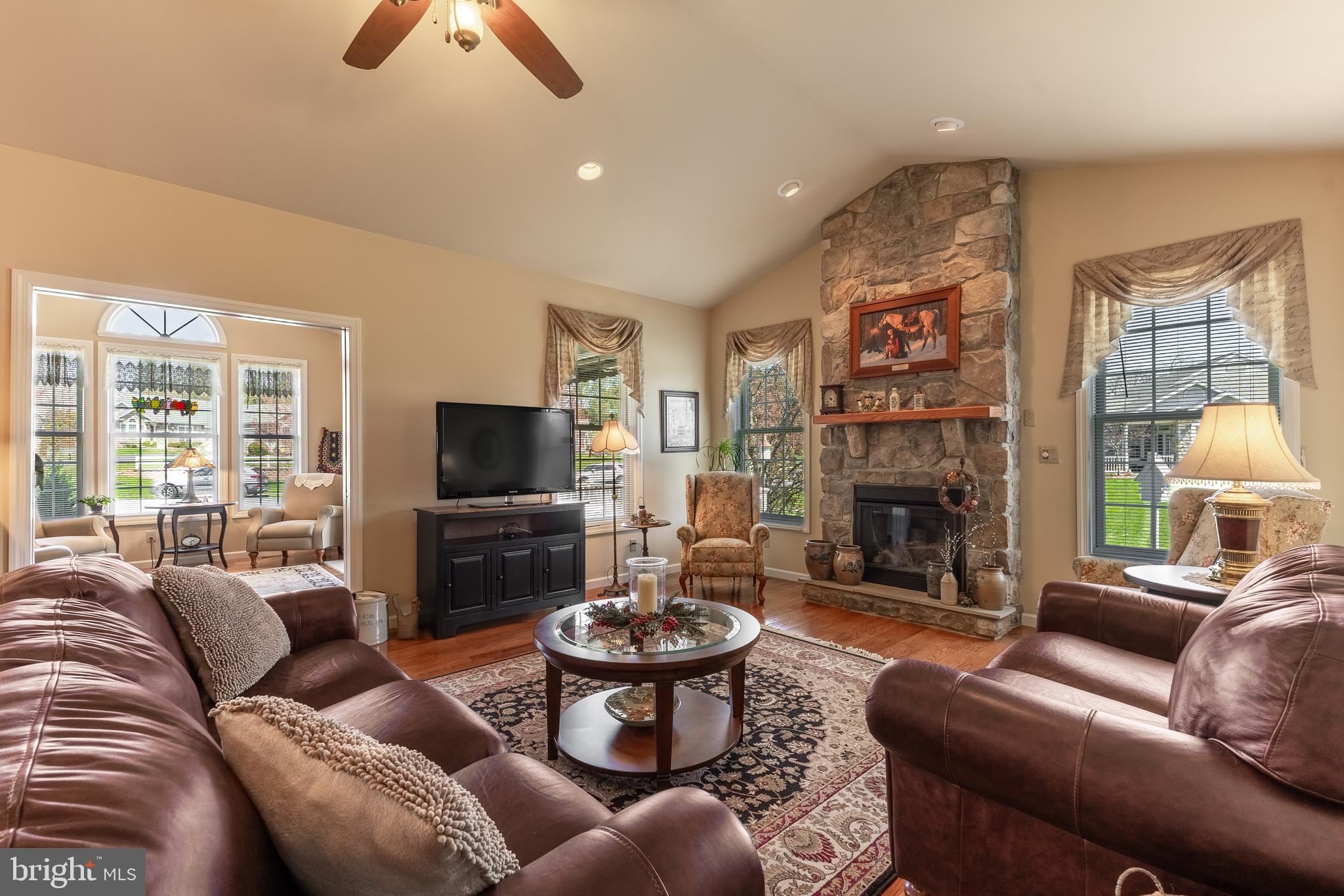 169 Quarry Street Bellefonte, PA 16823 - Photo 6 of 30 a living room with furniture a flat screen tv and a fireplace