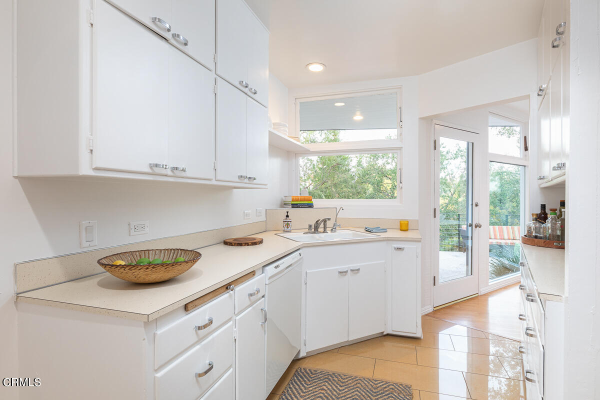 1707 Kaweah Drive Pasadena, CA 91105 - Photo 13 of 41 a kitchen with a sink cabinets and window