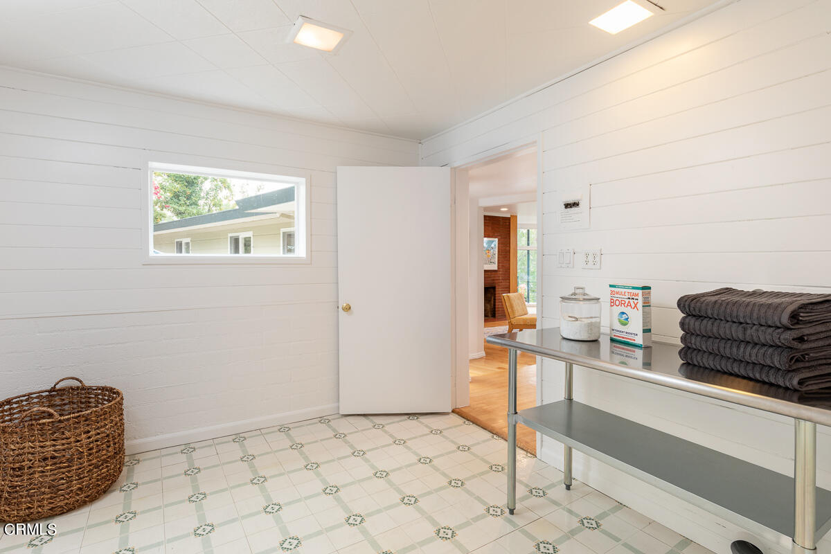 1707 Kaweah Drive Pasadena, CA 91105 - Photo 22 of 41 a living room with a couch and a stove top oven