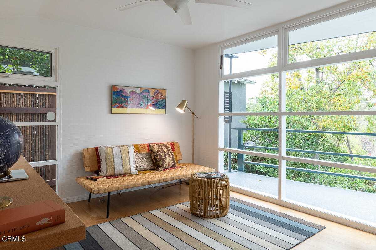 1707 Kaweah Drive Pasadena, CA 91105 - Photo 30 of 41 a living room with furniture a rug and a floor to ceiling window