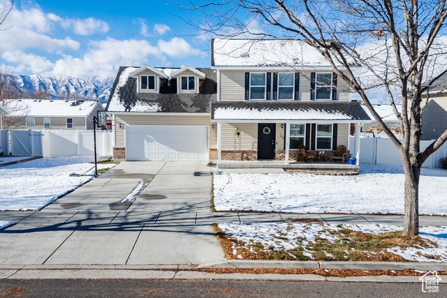 745 South 1500th Street West Logan, UT 84321 - Photo 1 of 1 Front facade with a mountain view and a two car garage