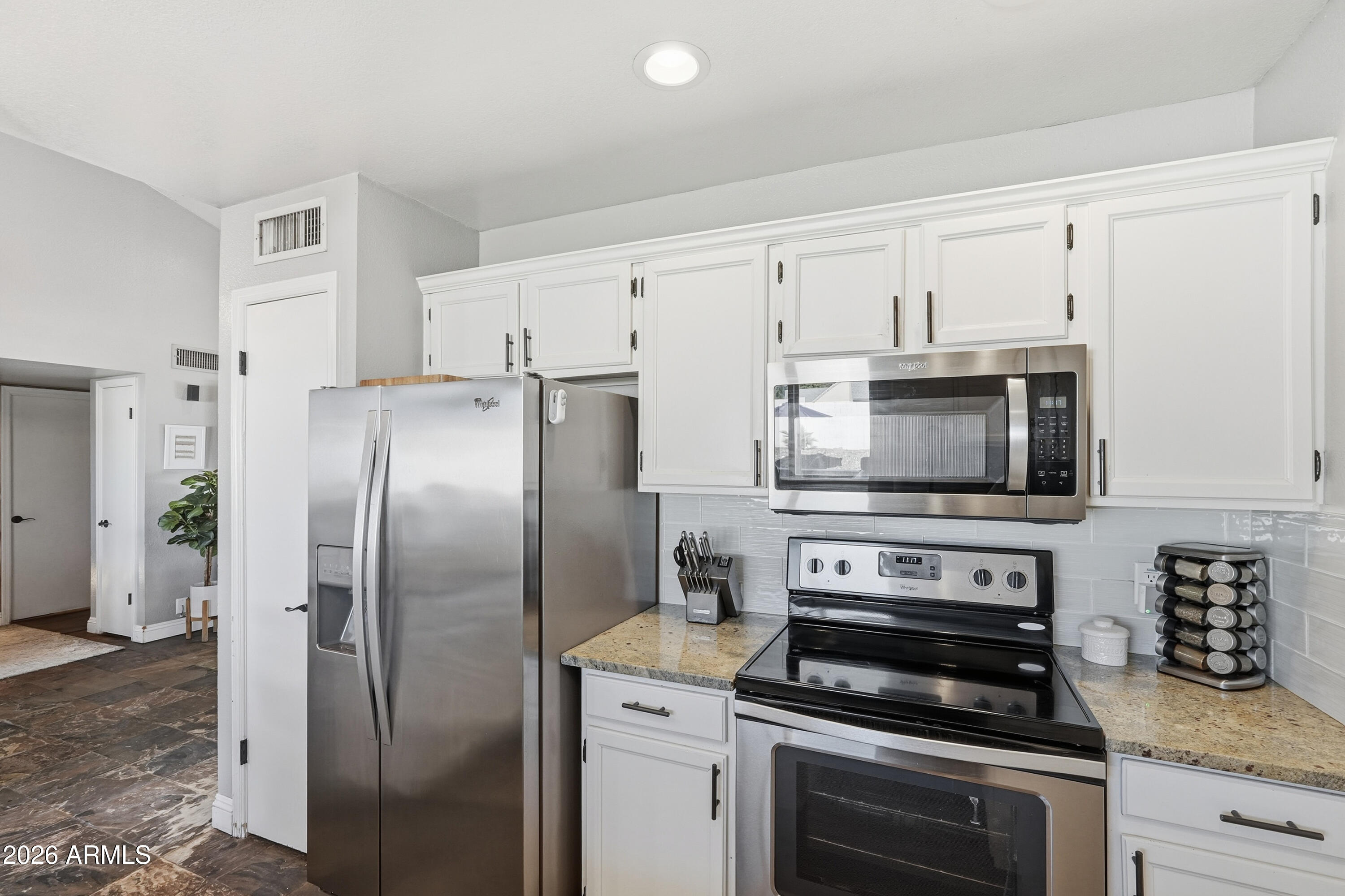 1314 East Utopia Road Phoenix, AZ 85024 - Photo 12 of 33 a kitchen with cabinets stainless steel appliances and a counter space