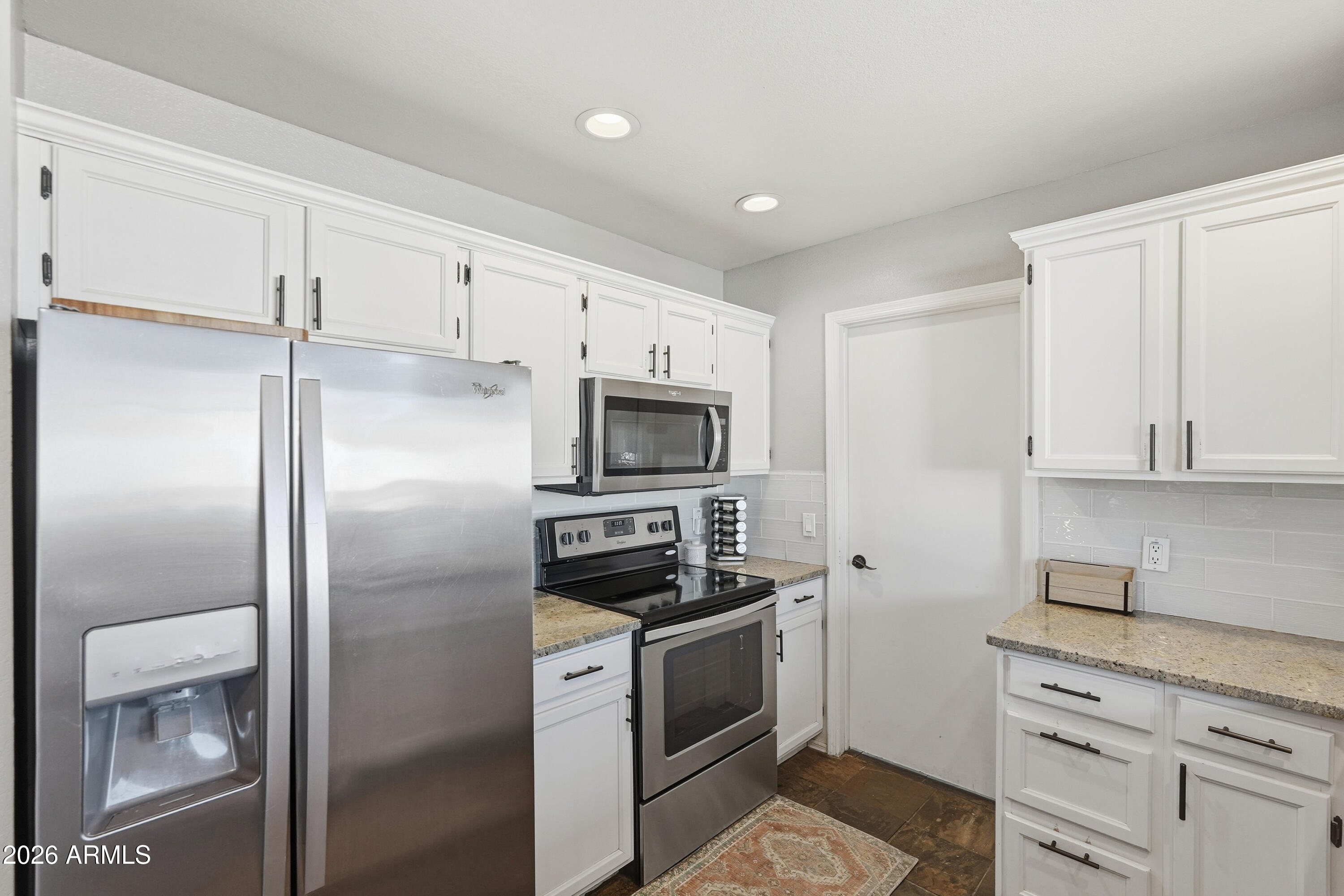 1314 East Utopia Road Phoenix, AZ 85024 - Photo 13 of 33 a kitchen with a refrigerator stove and microwave