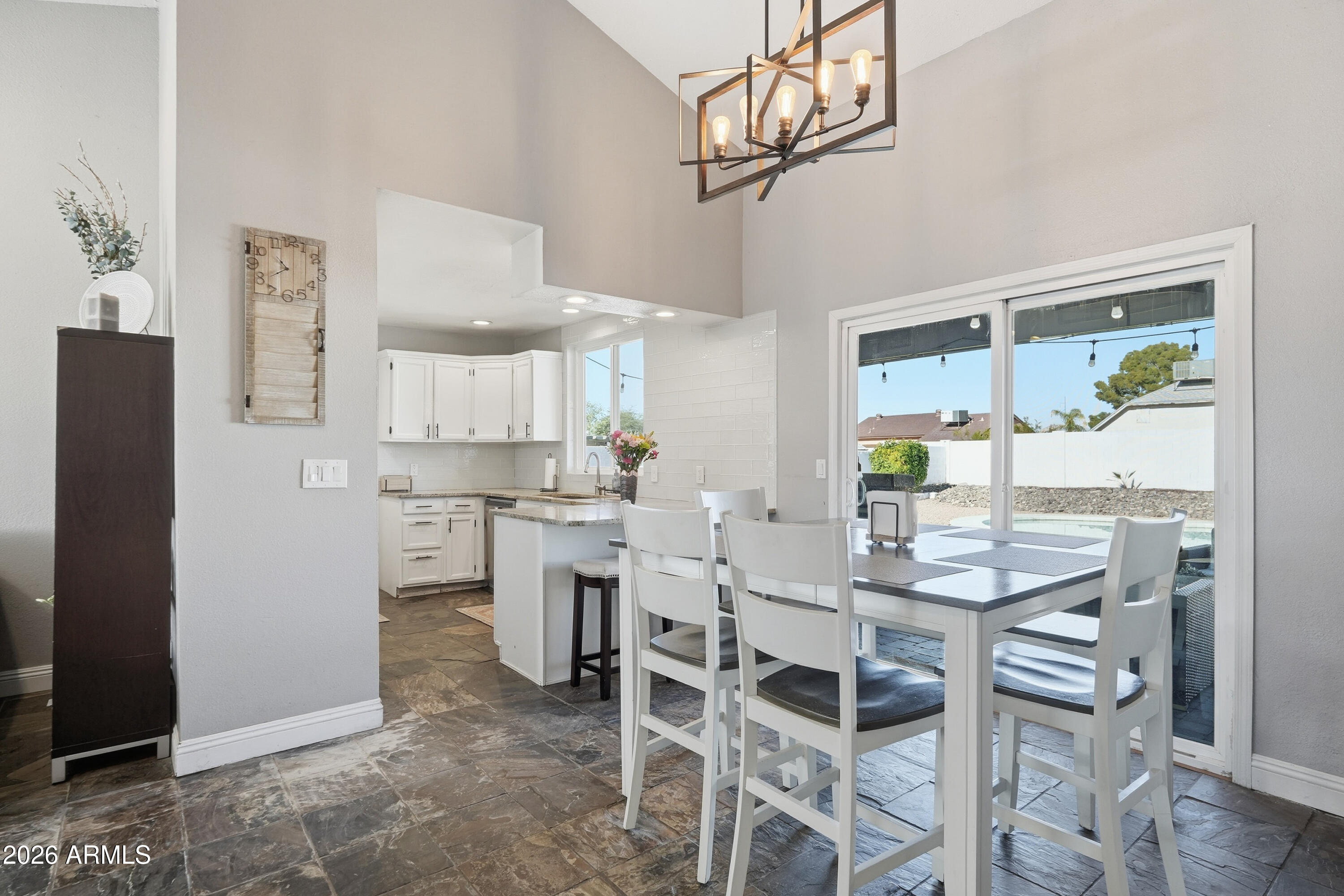 1314 East Utopia Road Phoenix, AZ 85024 - Photo 14 of 33 a view of a dining room with furniture
