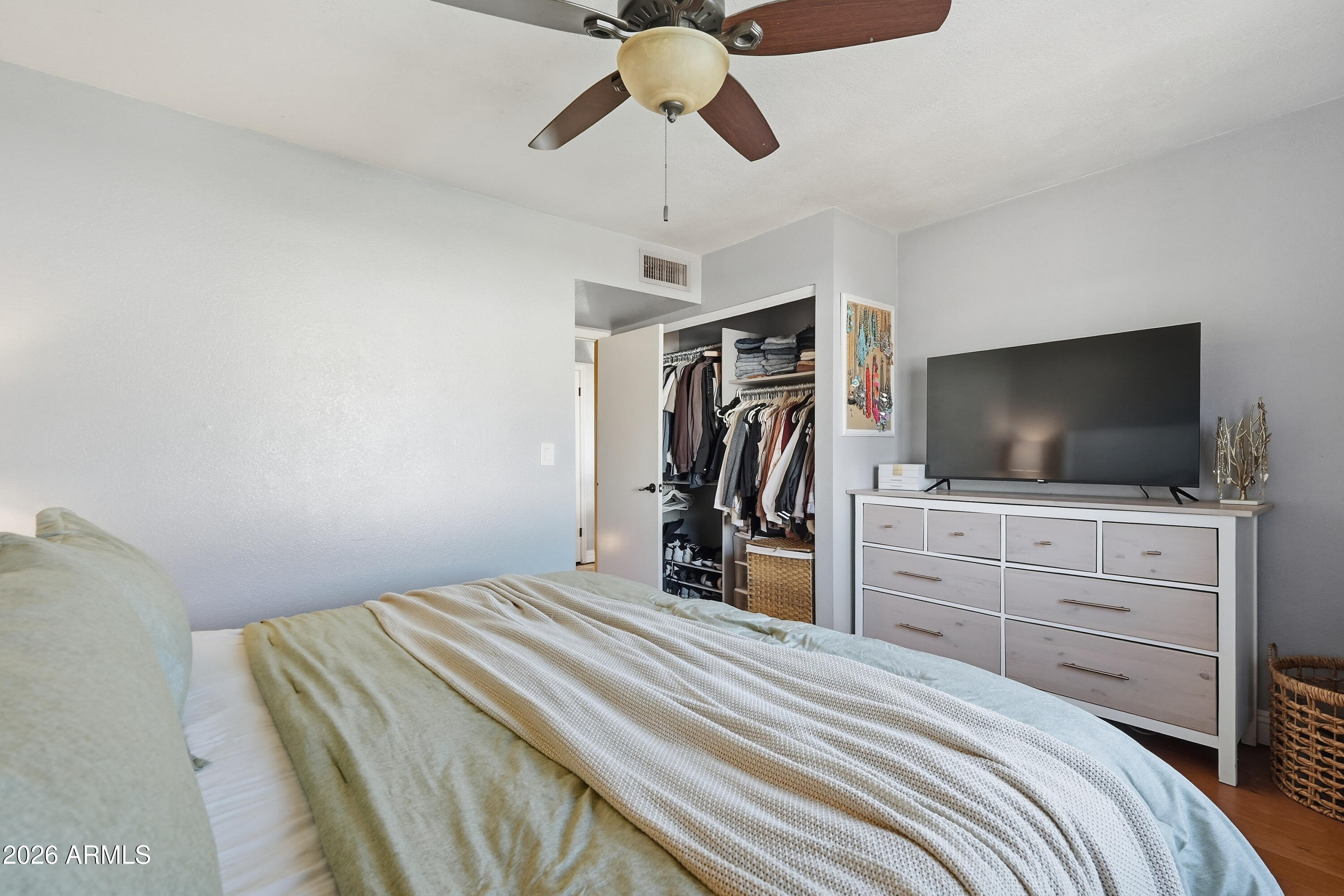 1314 East Utopia Road Phoenix, AZ 85024 - Photo 19 of 33 a bedroom with a bed and a flat screen tv
