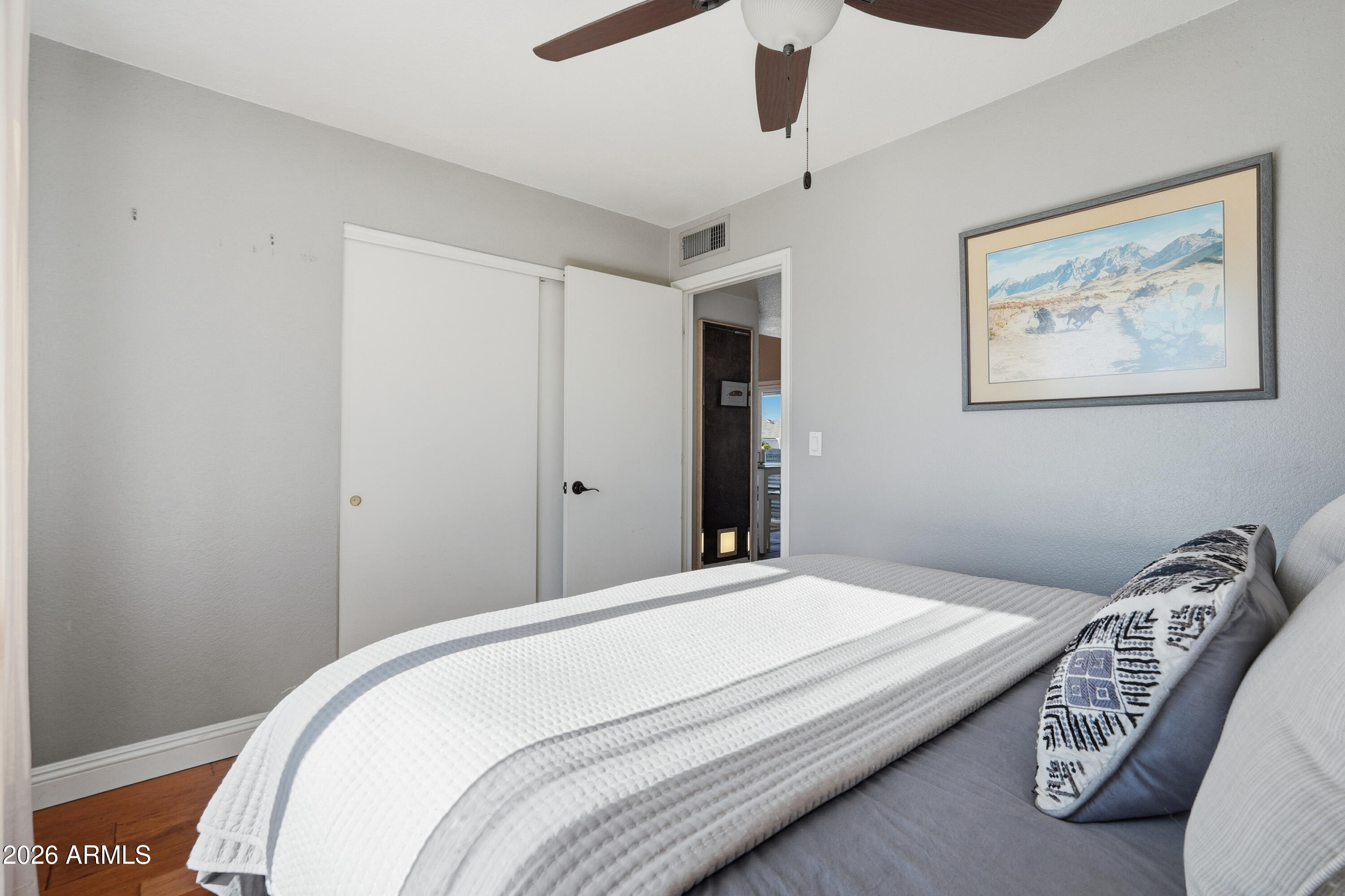 1314 East Utopia Road Phoenix, AZ 85024 - Photo 22 of 33 a bedroom with bed and a painting on the wall