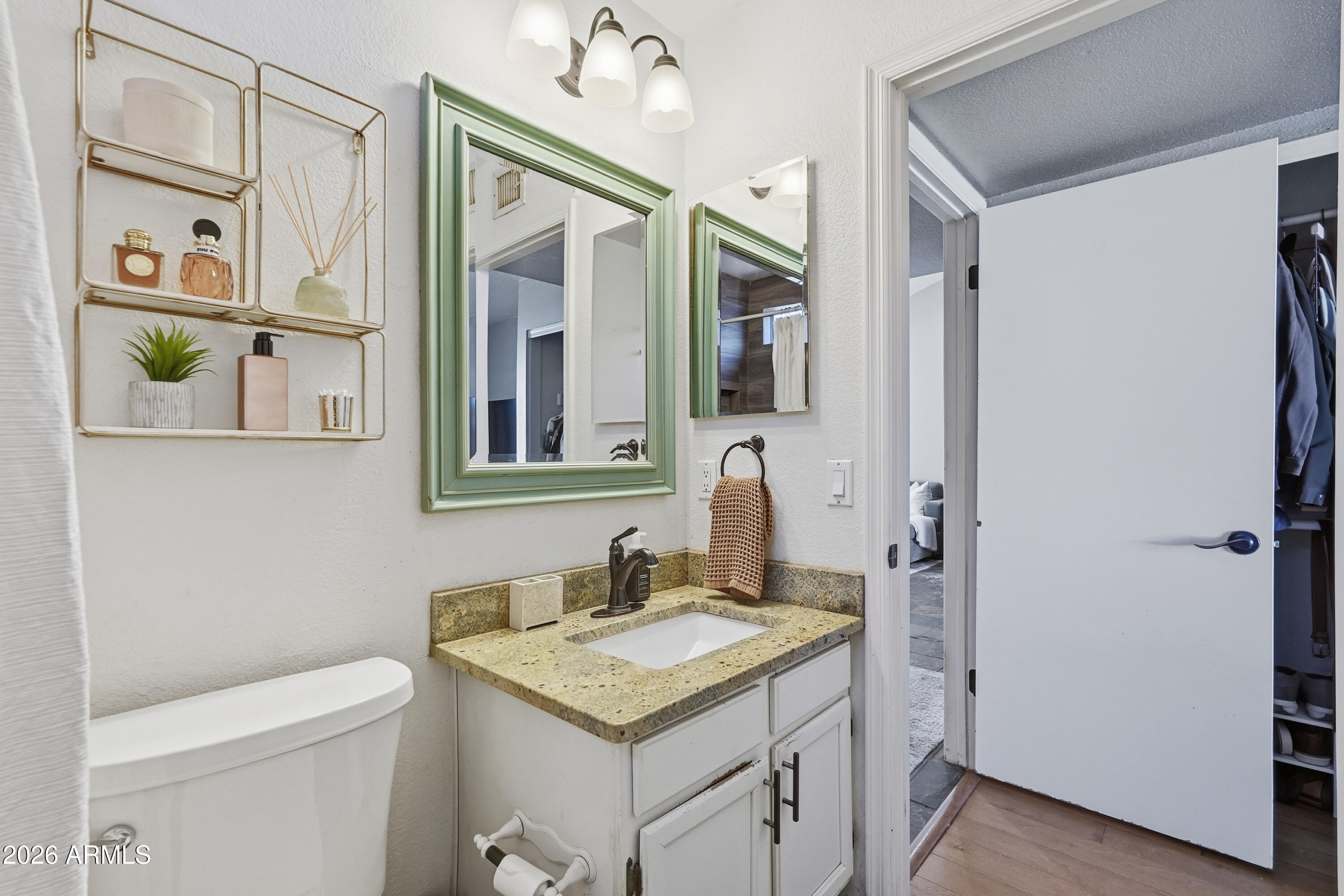 1314 East Utopia Road Phoenix, AZ 85024 - Photo 24 of 33 a bathroom with a granite countertop sink and a mirror