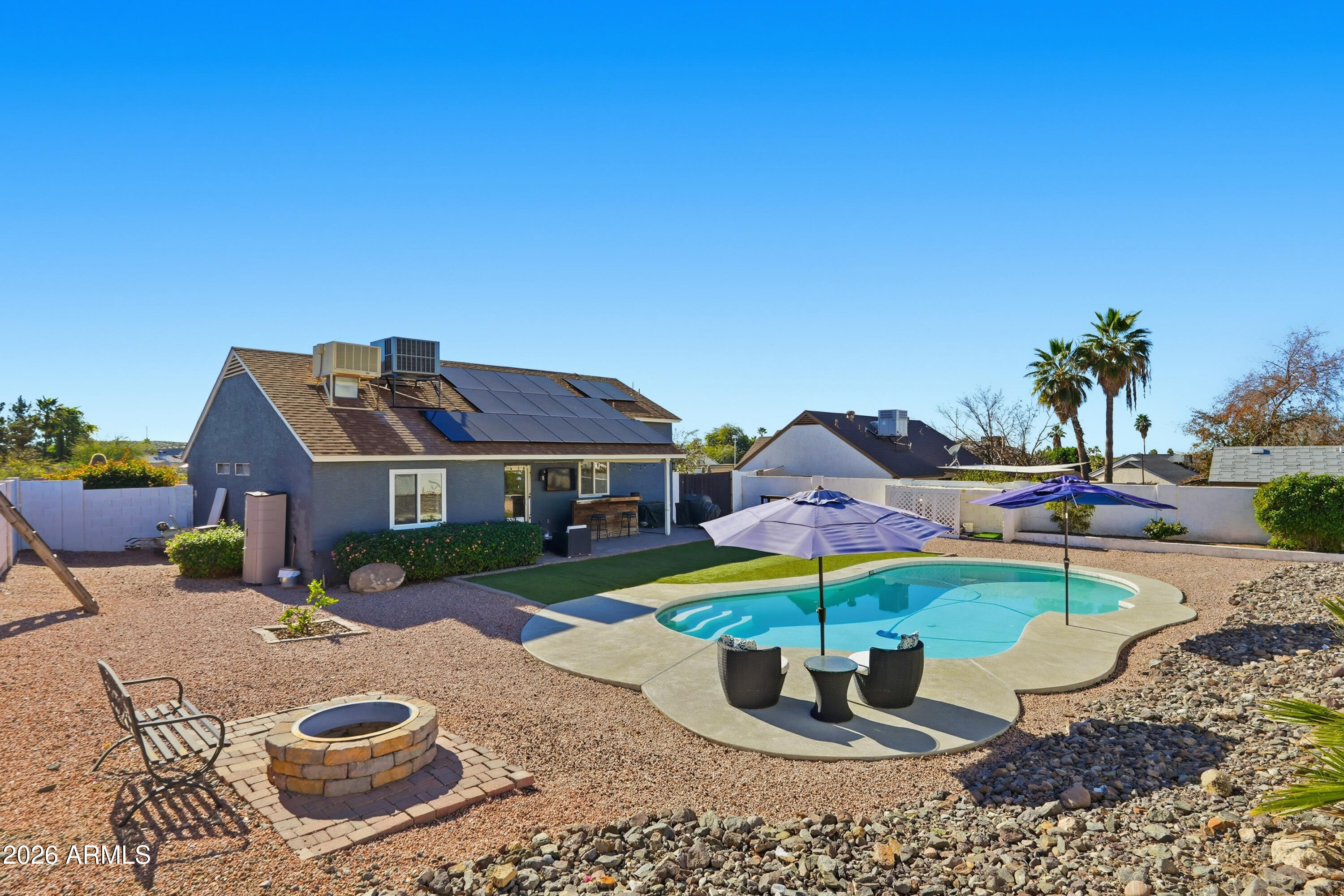 1314 East Utopia Road Phoenix, AZ 85024 - Photo 30 of 33 a front view of a house with a garden