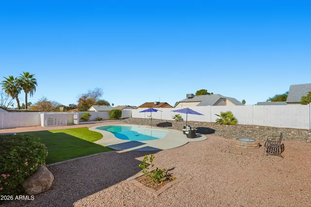 a couple of cars parked in front of a house