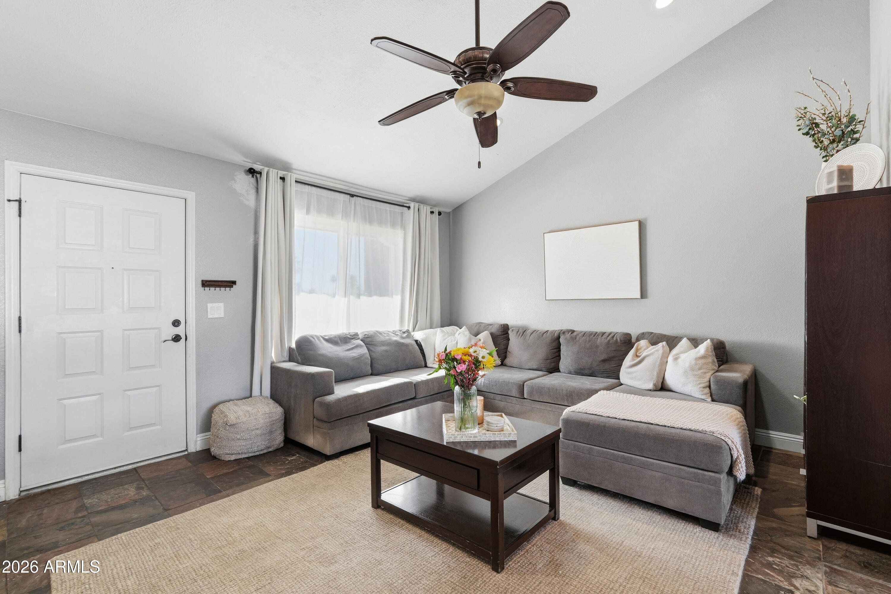 1314 East Utopia Road Phoenix, AZ 85024 - Photo 6 of 33 a living room with furniture and a ceiling fan