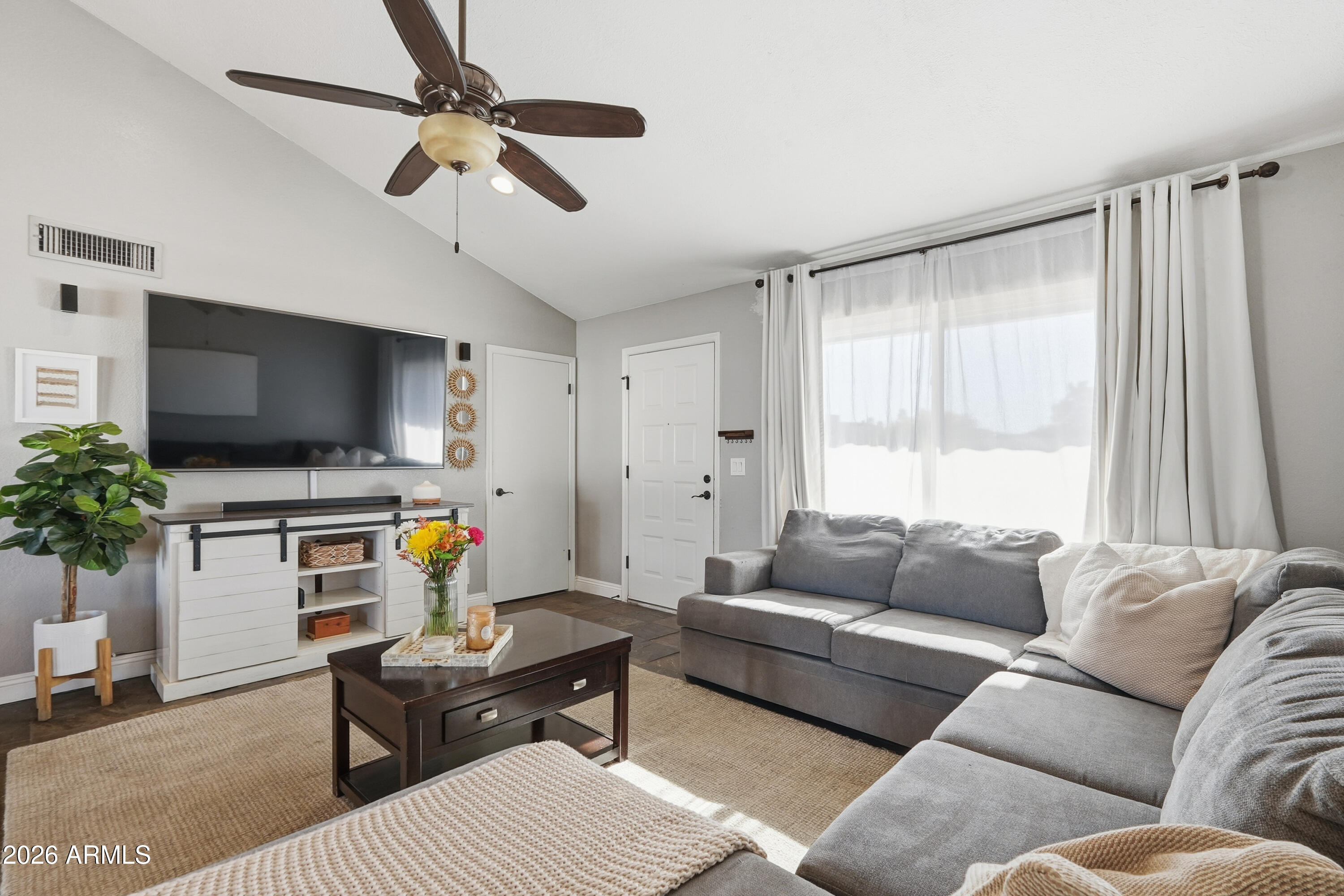1314 East Utopia Road Phoenix, AZ 85024 - Photo 7 of 33 a living room with furniture and a flat screen tv