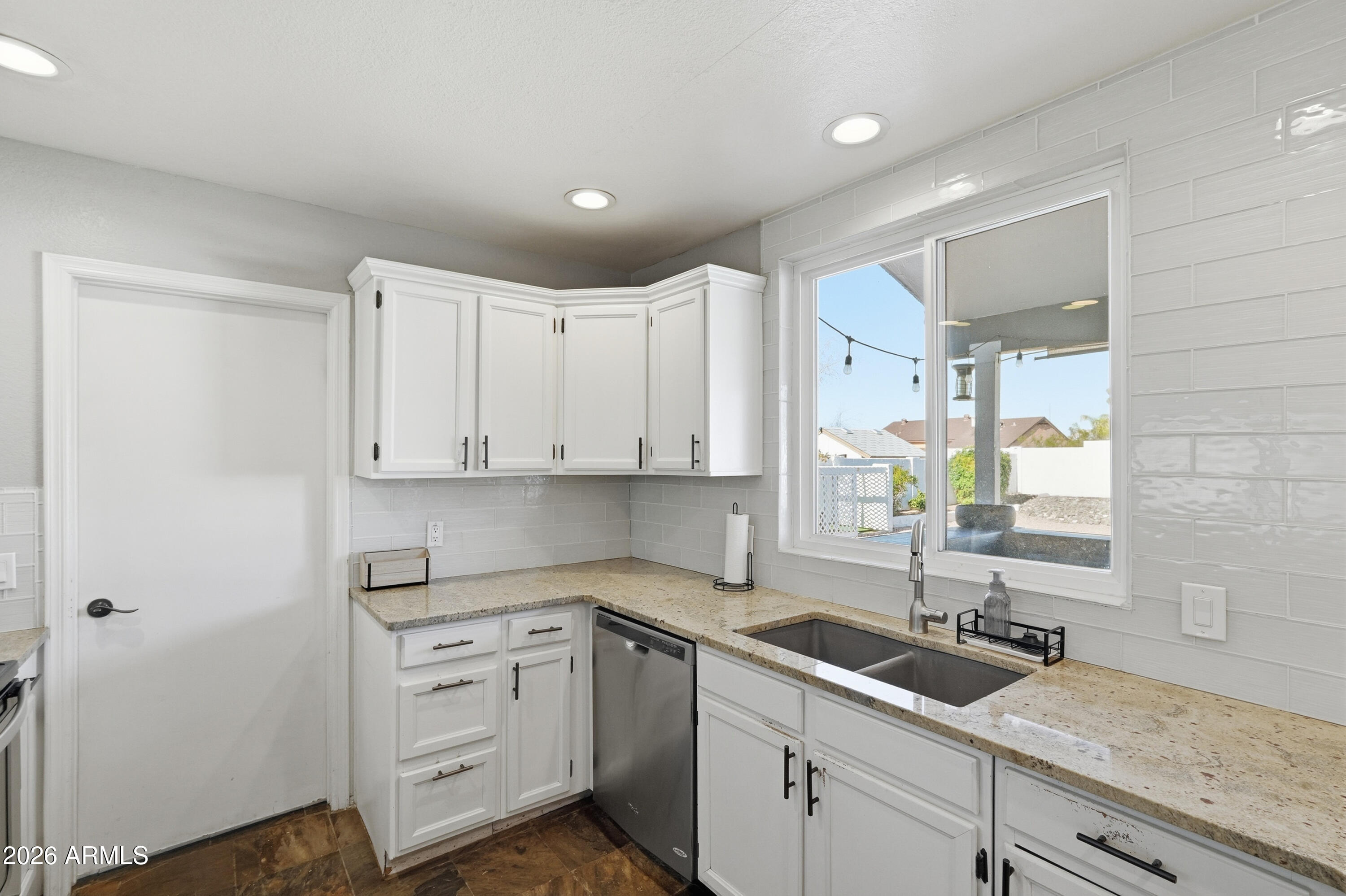 1314 East Utopia Road Phoenix, AZ 85024 - Photo 10 of 33 a kitchen with sink cabinets and window