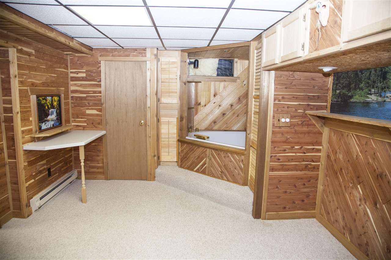 13026 West State Road Winnebago, IL 61088 - Photo 12 of 24 a view of walk in closet with clothes and shoes
