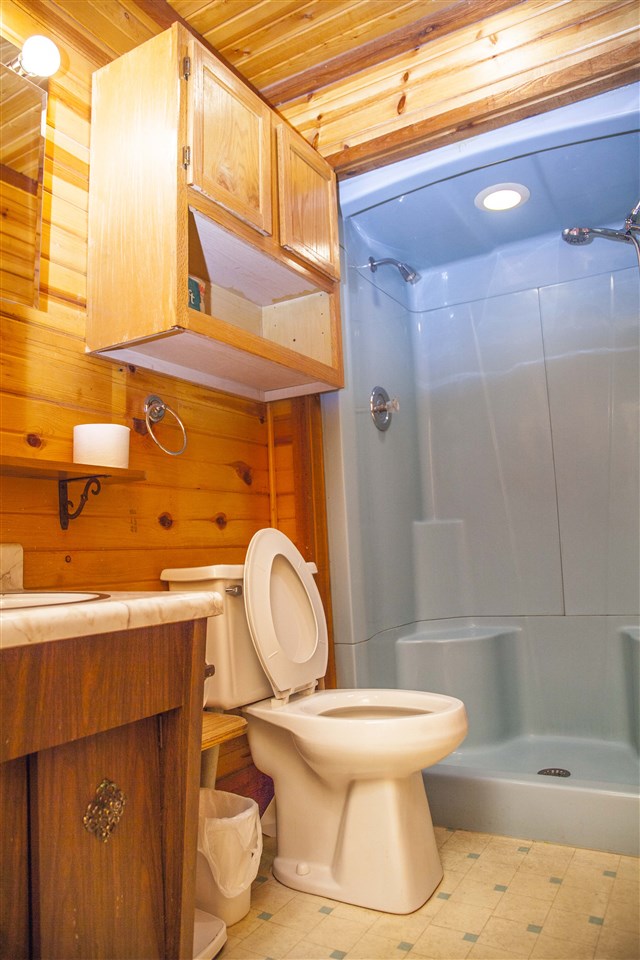 13026 West State Road Winnebago, IL 61088 - Photo 17 of 24 a bathroom with a sink toilet and shower