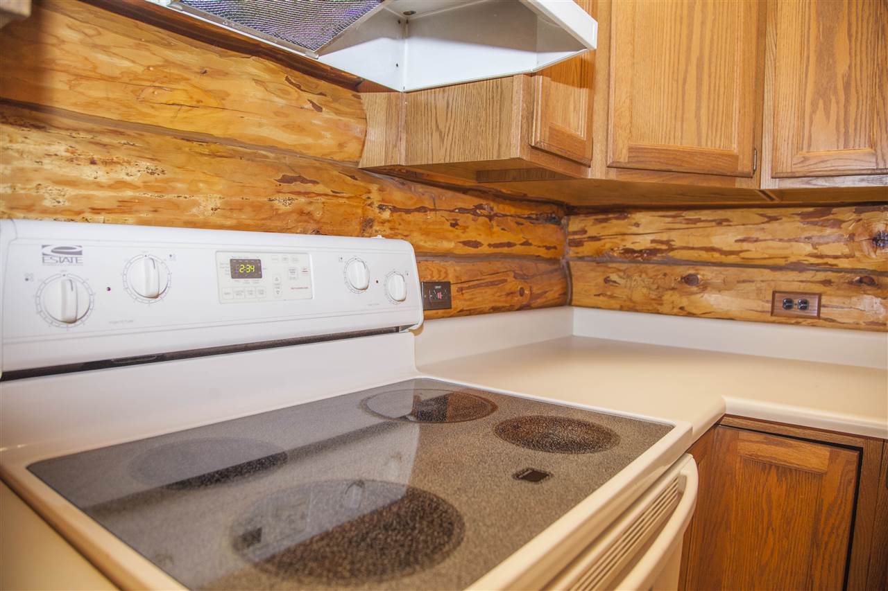 13026 West State Road Winnebago, IL 61088 - Photo 4 of 24 a kitchen with a sink and a stove top oven