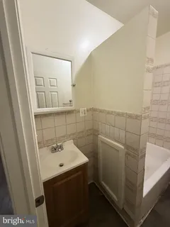 a bathroom with a sink and mirror
