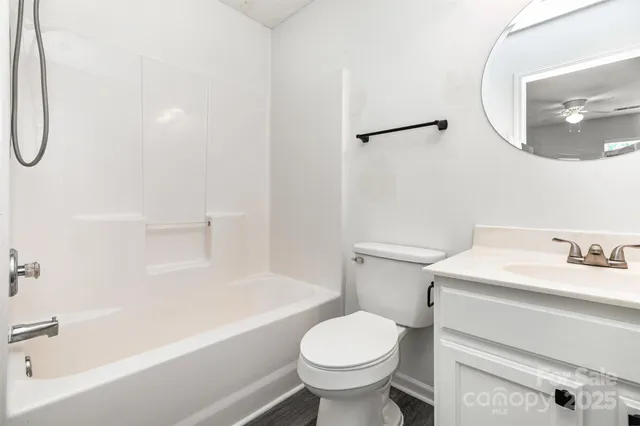 a bathroom with a sink a toilet and a bathtub