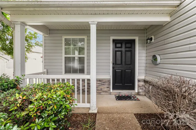 a front view of a house with a large window