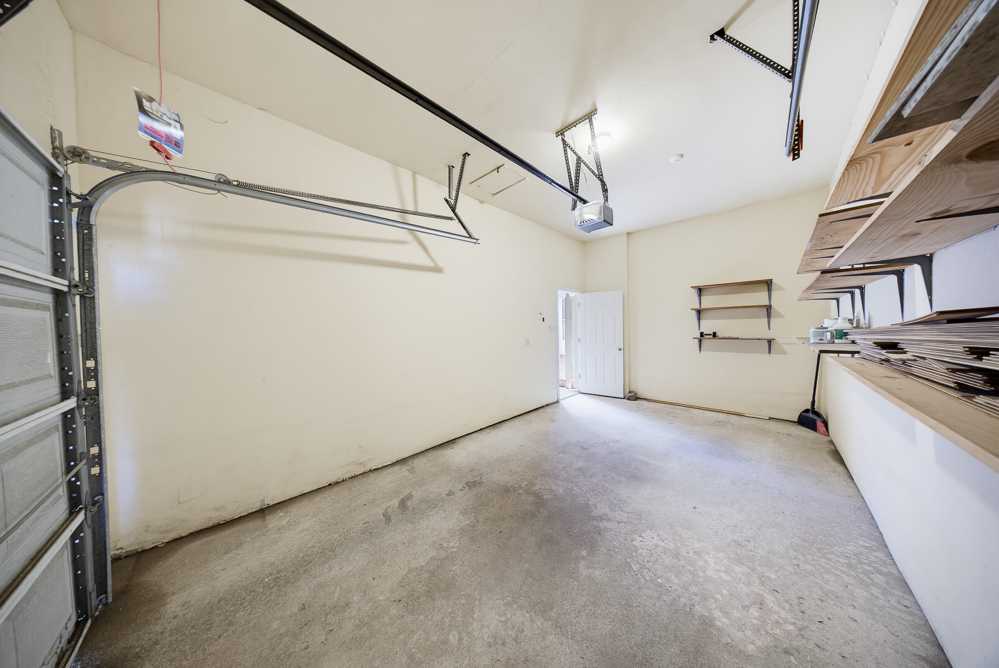 727 Bunker Hill Road, Unit 34 Houston, TX 77024 - Photo 36 of 38 Space for an additional vehicle and some shelving in place for your items.