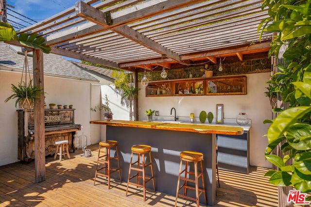 a view of a house with pool yard and sitting area
