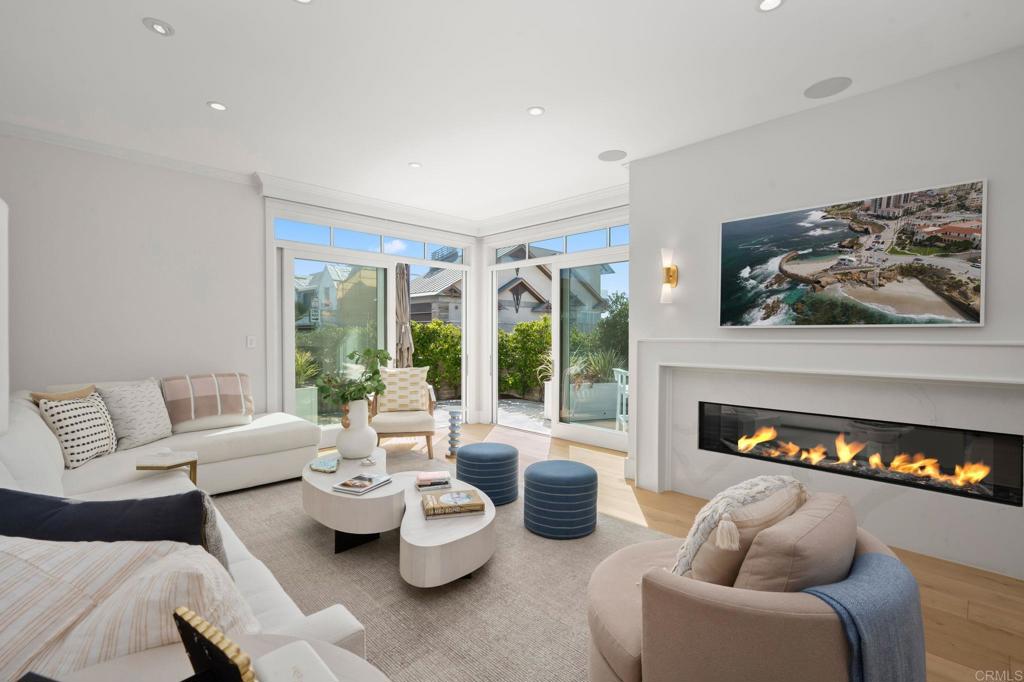 2211 Ocean Front Del Mar, CA 92014 - Photo 3 of 13 a living room with furniture and a fireplace